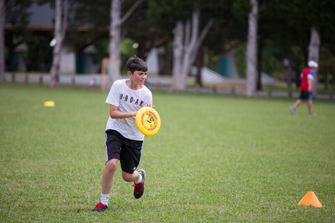 A boy playing frisbee at the YMCA of Greater Charlotte